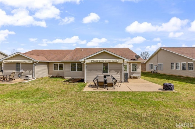 1654 Napoleon Dr, Bonne Terre, MO 63628 - back of property with a patio, a lawn, and a fire pit
