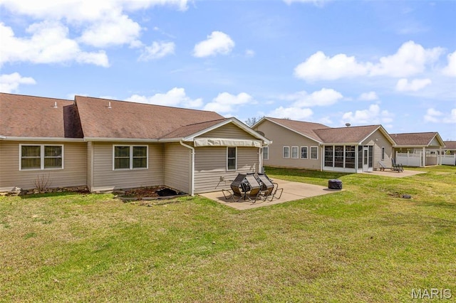 1654 Napoleon Dr, Bonne Terre, MO 63628 - back of property with a patio, a sunroom, and a yard