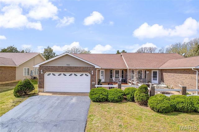 1654 Napoleon Dr, Bonne Terre, MO 63628 - ranch-style home featuring driveway, brick siding, a garage, and a front yard