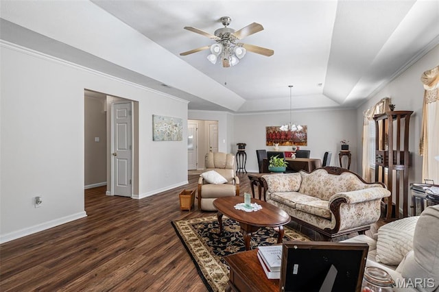 1654 Napoleon Dr, Bonne Terre, MO 63628 - living area with dark wood-style floors, a ceiling fan, a tray ceiling, baseboards, and a chandelier