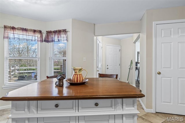 1654 Napoleon Dr, Bonne Terre, MO 63628 - dining area with light tile patterned floors and baseboards