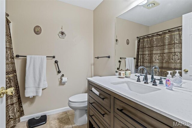 1654 Napoleon Dr, Bonne Terre, MO 63628 - bathroom with toilet, vanity, tile patterned flooring, and baseboards
