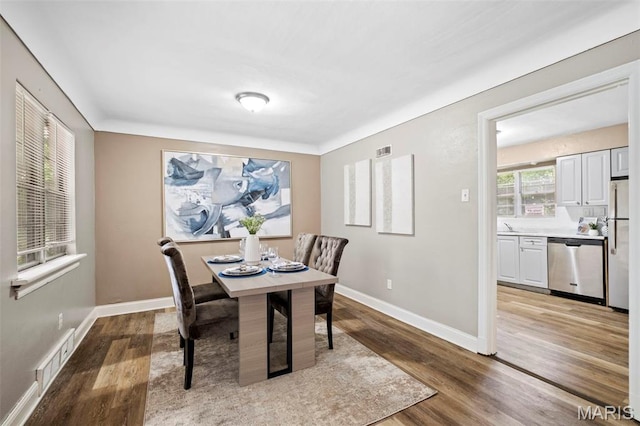 309 N Schlueter Ave, Saint Louis, MO 63135 - dining area with wood finished floors and baseboards