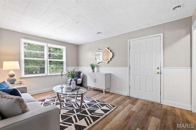 309 N Schlueter Ave, Saint Louis, MO 63135 - living room with wood finished floors and wainscoting