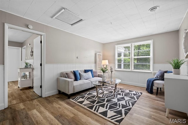 309 N Schlueter Ave, Saint Louis, MO 63135 - living room with wood finished floors and a wainscoted wall