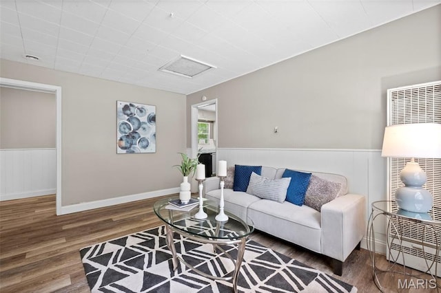 309 N Schlueter Ave, Saint Louis, MO 63135 - living area featuring wood finished floors and a wainscoted wall
