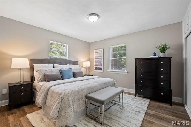 309 N Schlueter Ave, Saint Louis, MO 63135 - bedroom with dark wood-style flooring and baseboards