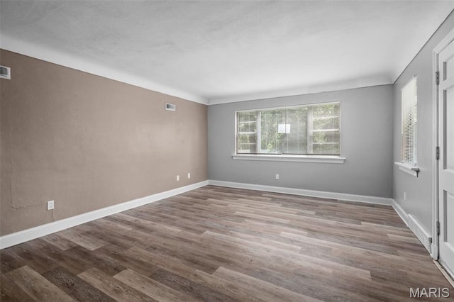 309 N Schlueter Ave, Saint Louis, MO 63135 - spare room with wood finished floors and baseboards