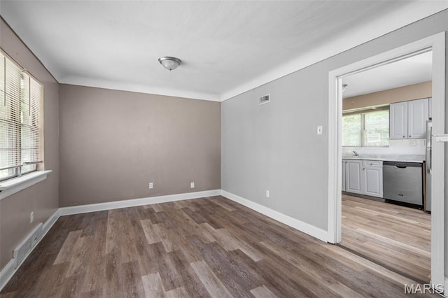 309 N Schlueter Ave, Saint Louis, MO 63135 - spare room with wood finished floors