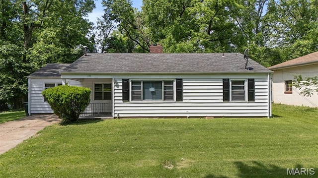 309 N Schlueter Ave, Saint Louis, MO 63135 - view of front of home featuring a front lawn and a chimney