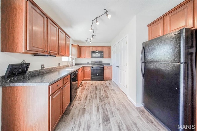14056 State Route O, Rolla, MO 65401 - kitchen with black appliances, light wood-type flooring, dark countertops, rail lighting, and baseboards