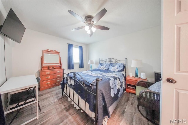 14056 State Route O, Rolla, MO 65401 - bedroom featuring wood finished floors and ceiling fan