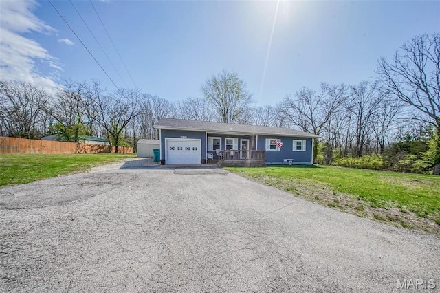 14056 State Route O, Rolla, MO 65401 - ranch-style house featuring an attached garage, covered porch, and asphalt driveway
