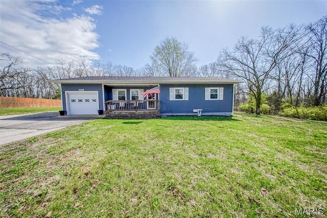 14056 State Route O, Rolla, MO 65401 - single story home with asphalt driveway, an attached garage, a front lawn, and covered porch