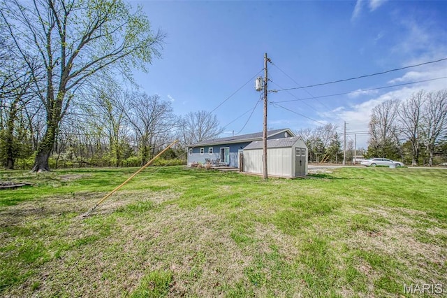 14056 State Route O, Rolla, MO 65401 - view of green lawn featuring an outbuilding and a storage shed