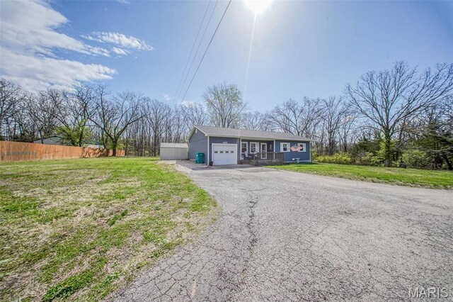 14056 State Route O, Rolla, MO 65401 - ranch-style house with an attached garage and asphalt driveway