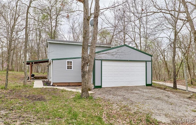 detached garage featuring driveway
