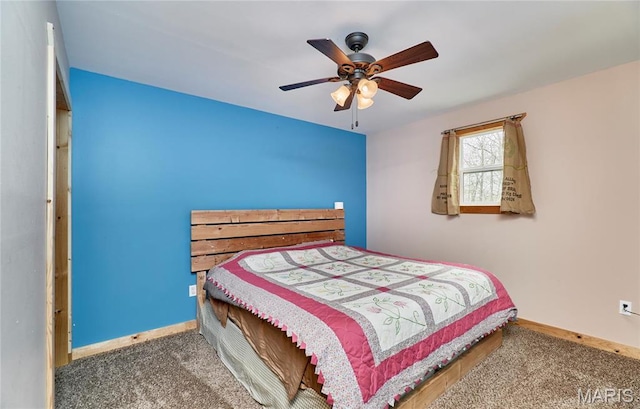 carpeted bedroom with baseboards and a ceiling fan