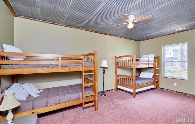 carpeted bedroom featuring baseboards