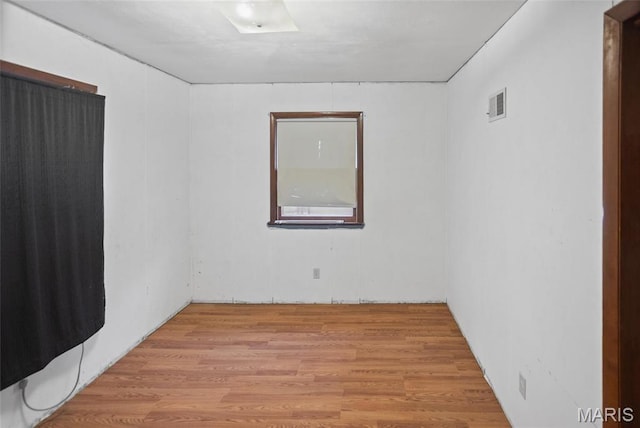 spare room featuring light wood-style flooring