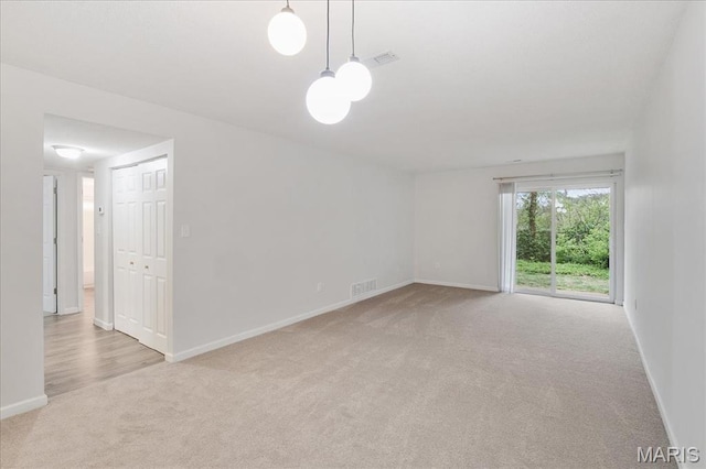 2014 Greenglen Dr Unit 101, Saint Louis, MO 63122 - carpeted spare room featuring baseboards