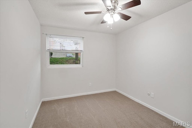 2014 Greenglen Dr Unit 101, Saint Louis, MO 63122 - carpeted empty room featuring baseboards, a textured ceiling, and ceiling fan