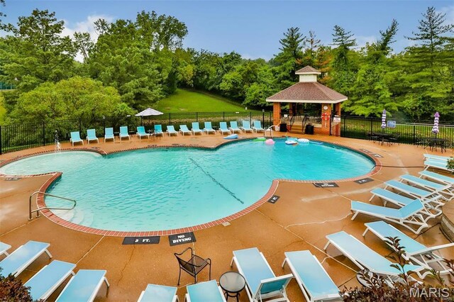 2014 Greenglen Dr Unit 101, Saint Louis, MO 63122 - community pool featuring fence, a gazebo, a patio area, and view of scattered trees