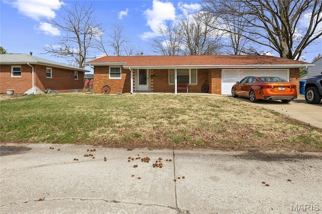 2533 Ivy Ln, Granite City, IL 62040 - single story home featuring a garage, covered porch, brick siding, and concrete driveway