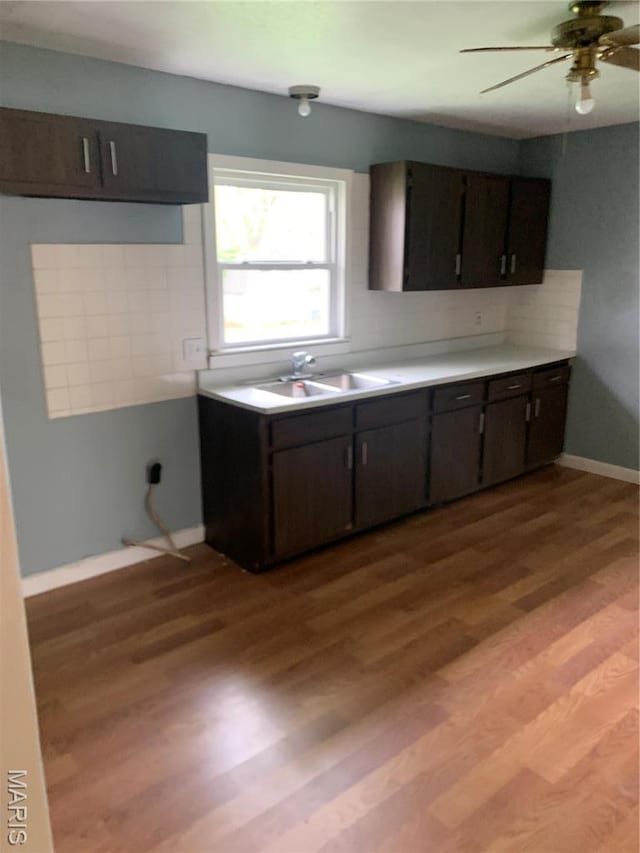 200 Easton St, Bonne Terre, MO 63628 - kitchen featuring a sink, light countertops, ceiling fan, and light wood-style flooring