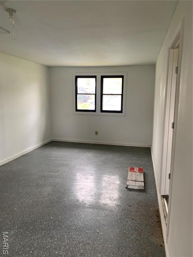 200 Easton St, Bonne Terre, MO 63628 - empty room featuring speckled floor and baseboards