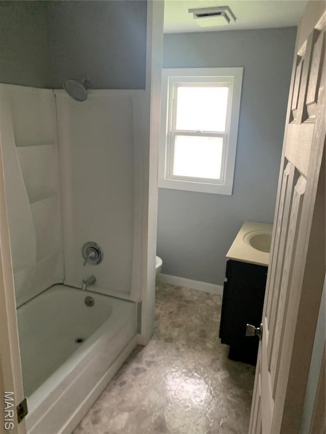 200 Easton St, Bonne Terre, MO 63628 - bathroom with toilet, vanity, washtub / shower combination, and baseboards