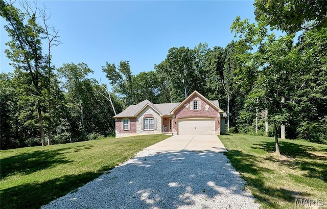 440 Winchester Way, Winfield, MO 63389 - view of front of home with concrete driveway, an attached garage, and a front lawn