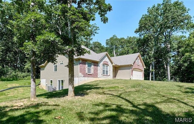 440 Winchester Way, Winfield, MO 63389 - view of side of property featuring a yard and a garage