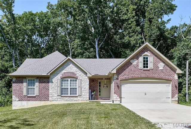 440 Winchester Way, Winfield, MO 63389 - ranch-style house featuring concrete driveway, a front yard, an attached garage, and roof with shingles