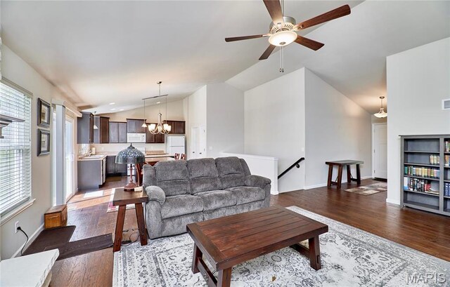 440 Winchester Way, Winfield, MO 63389 - living area with vaulted ceiling, healthy amount of natural light, wood finished floors, ceiling fan, and a chandelier