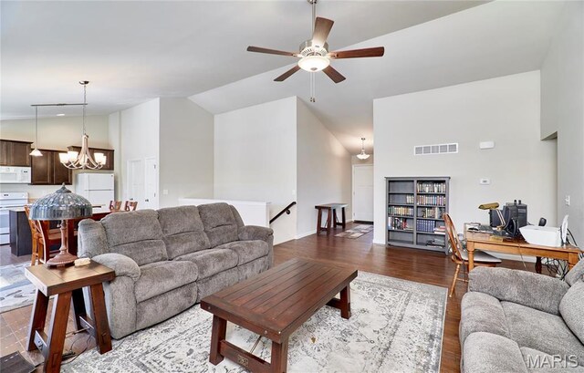 440 Winchester Way, Winfield, MO 63389 - living area with a desk, ceiling fan, wood finished floors, a chandelier, and high vaulted ceiling