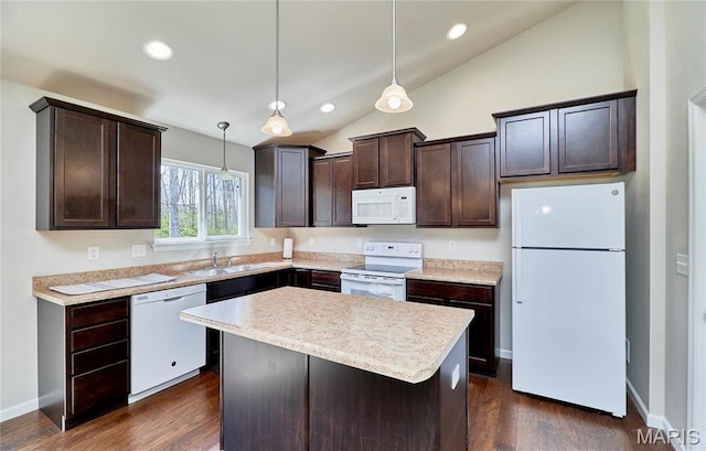 440 Winchester Way, Winfield, MO 63389 - kitchen featuring white appliances, dark brown cabinets, vaulted ceiling, light countertops, and a kitchen island