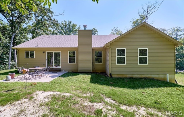 440 Winchester Way, Winfield, MO 63389 - rear view of property featuring a chimney, a yard, and a patio