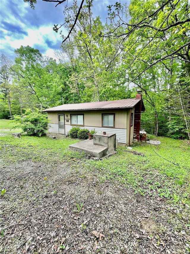 6405 Robin Ln, French Village, MO 63036 - back of house featuring a chimney