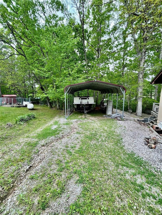 6405 Robin Ln, French Village, MO 63036 - view of grassy yard featuring a detached carport and driveway