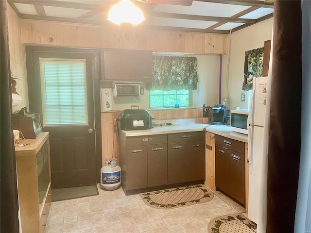 6405 Robin Ln, French Village, MO 63036 - kitchen featuring white appliances, light countertops, a wall mounted air conditioner, and ceiling fan