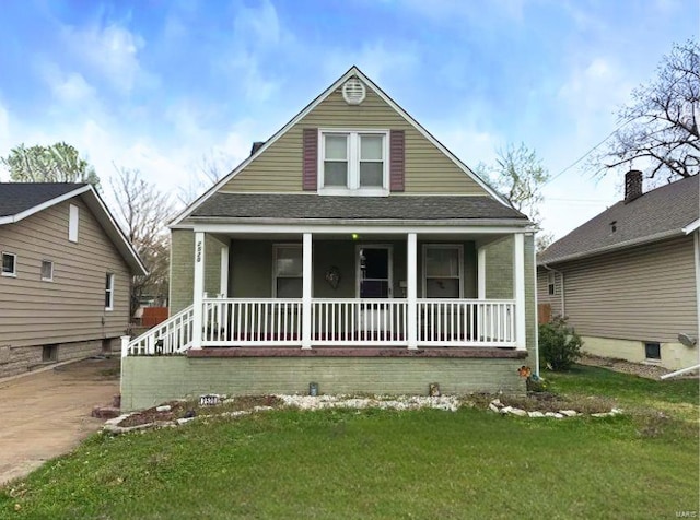 2520 State St, Granite City, IL 62040 - bungalow-style home featuring covered porch and a front lawn