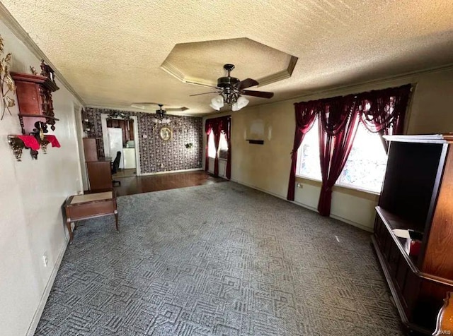 2520 State St, Granite City, IL 62040 - unfurnished living room with a textured ceiling, carpet, ceiling fan, crown molding, and baseboards
