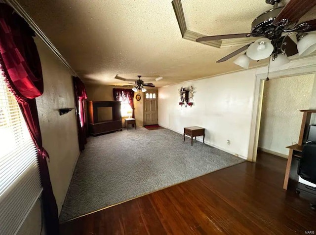 2520 State St, Granite City, IL 62040 - unfurnished living room featuring a textured ceiling, ceiling fan, and wood finished floors