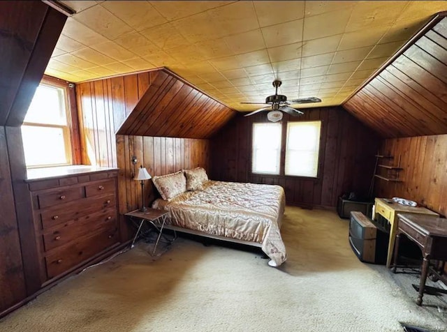 2520 State St, Granite City, IL 62040 - bedroom featuring wood walls, light carpet, vaulted ceiling, and ceiling fan