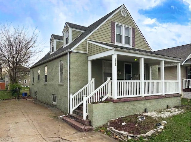 2520 State St, Granite City, IL 62040 - view of front of home with a porch and brick siding