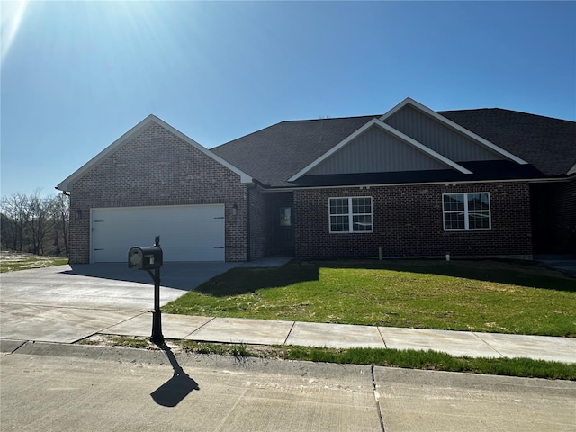 16 Creekside Way, Cape Girardeau, MO 63701 - view of front facade featuring brick siding, a garage, concrete driveway, and a front yard
