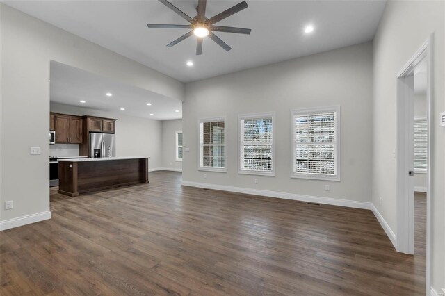 16 Creekside Way, Cape Girardeau, MO 63701 - unfurnished living room featuring ceiling fan, dark wood-style floors, baseboards, and recessed lighting
