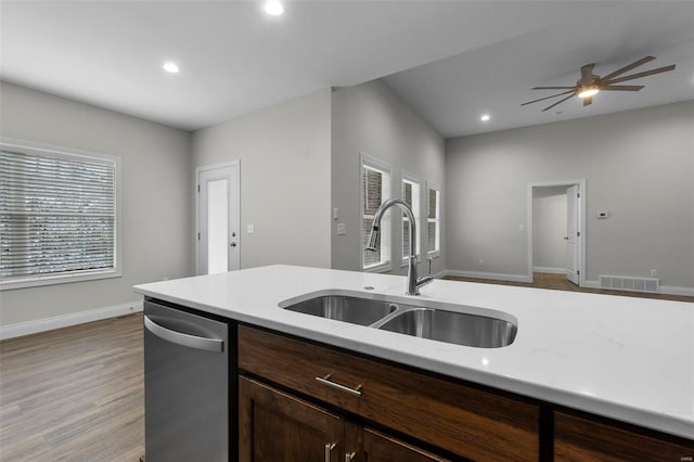 16 Creekside Way, Cape Girardeau, MO 63701 - kitchen featuring dishwasher, a sink, recessed lighting, baseboards, and light wood-style floors