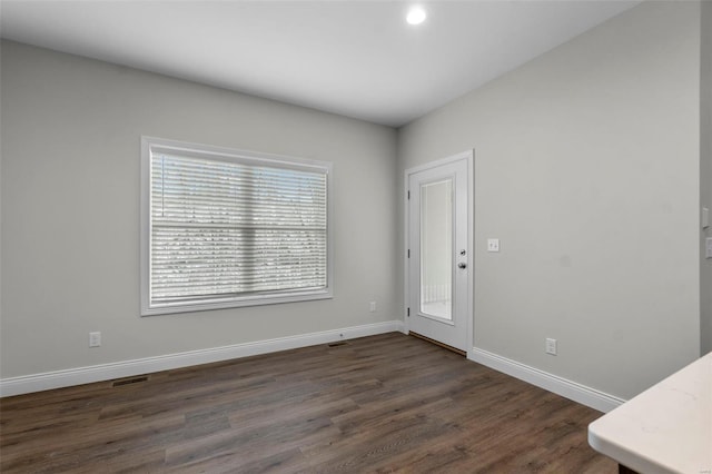 16 Creekside Way, Cape Girardeau, MO 63701 - spare room featuring baseboards, dark wood-style floors, and recessed lighting